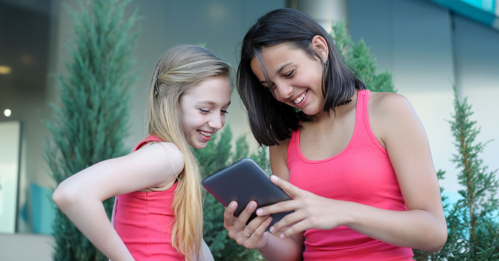 two teen girls with tablet